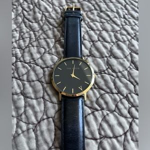 The Fifth - black and gold watch